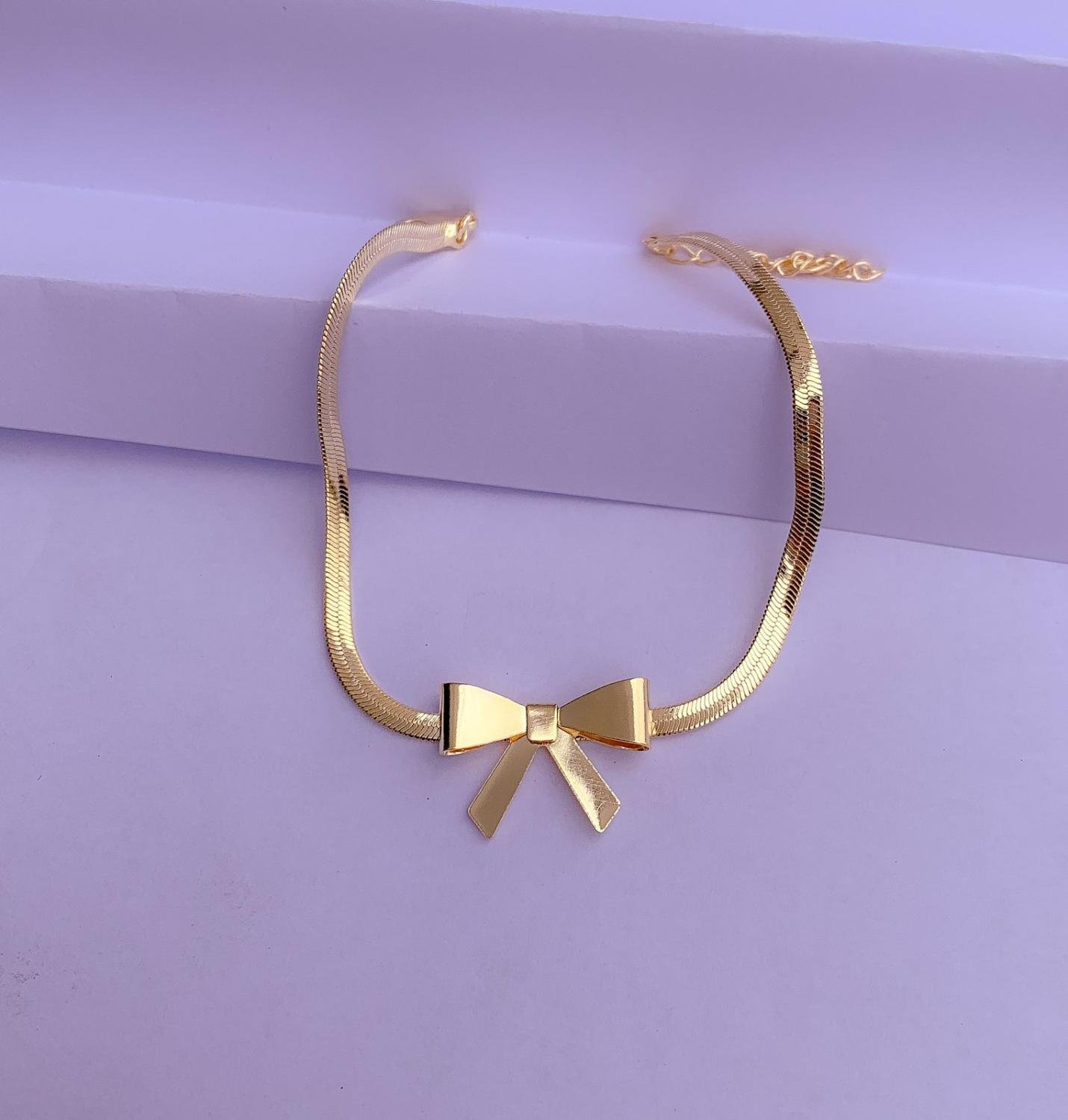 PULSEIRA FITA COM LAÇO OURO 18K